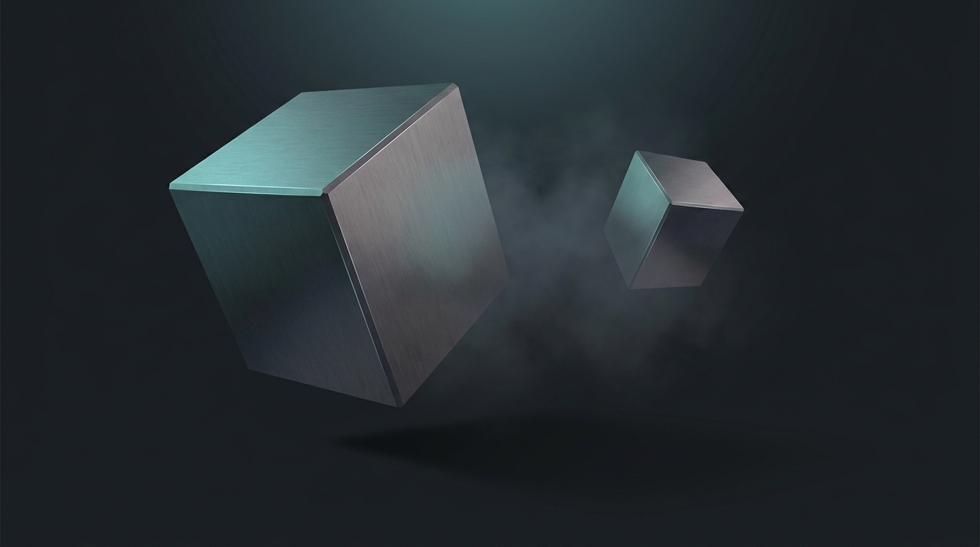 Two geometric prisms side by side on a dark surface, one larger than the other, lit with cool teal light.